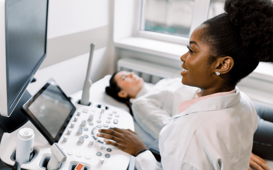 Woman giving an ultrasound explaining why you should receive an ultrasound before abortion