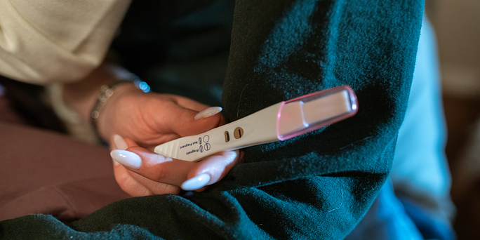 Woman asking herself "How do pregnancy tests work? How accurate are pregnancy tests?"