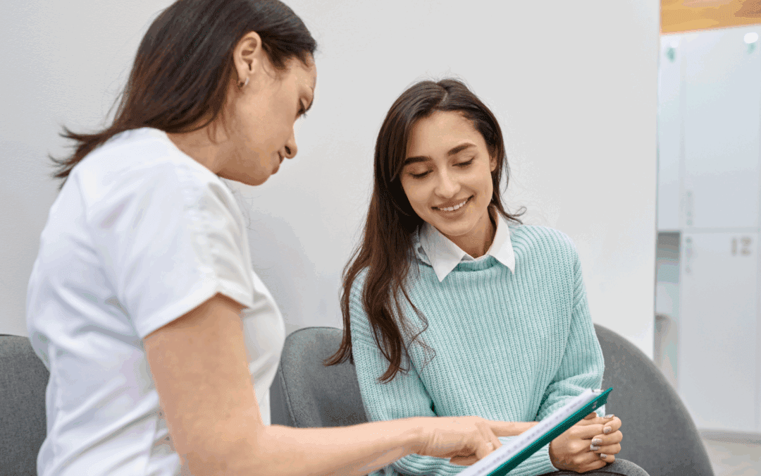woman receiving support from nurse